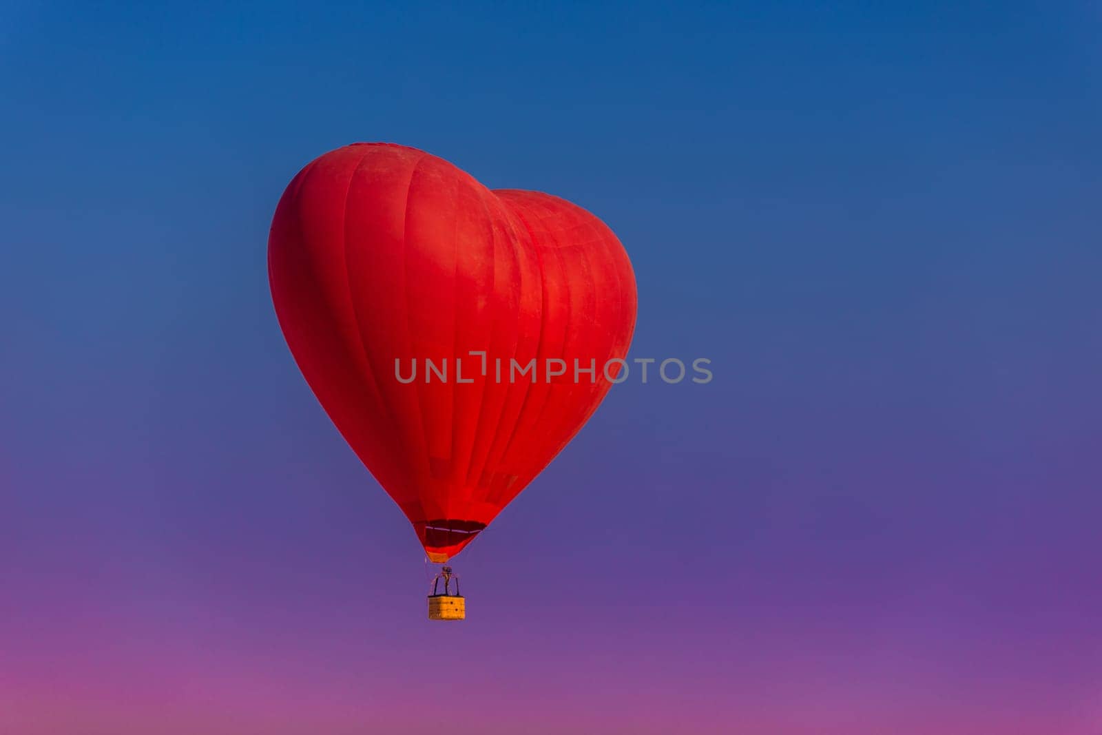 Postcard mockup with copyspace for Valentine's Day with a balloon in the shape of a red heart.