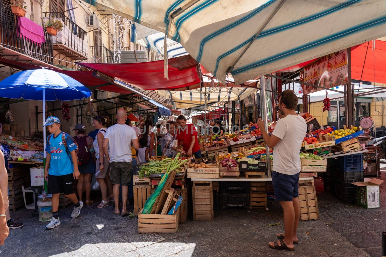 Palermo, Italy - July 20, 2023: Market stalls and people at famous and historical Capo Market
