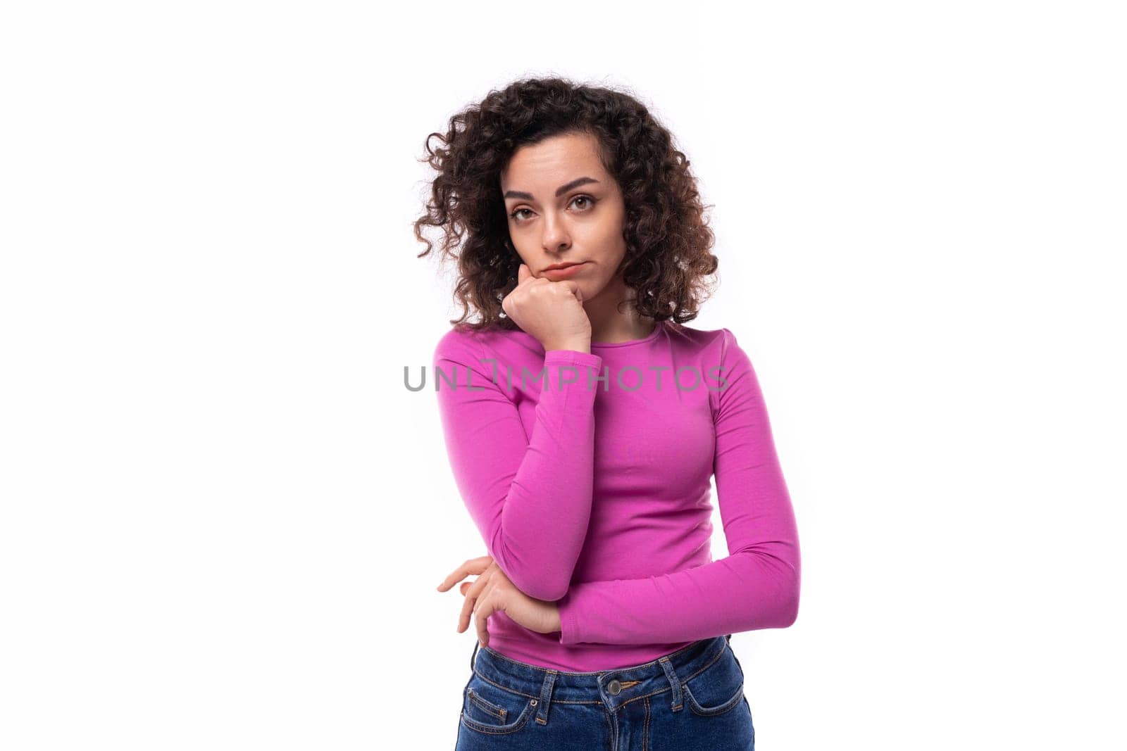 young smiling woman with curly well-groomed hair on a white background by TRMK