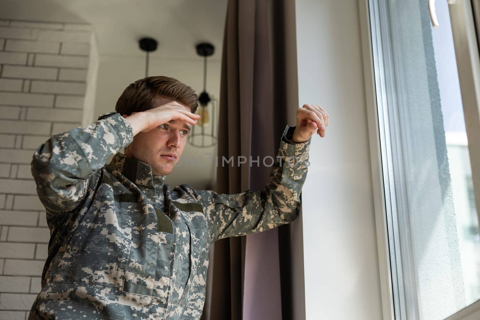Nervous male military suffering depression, alone at home, PTSD concept