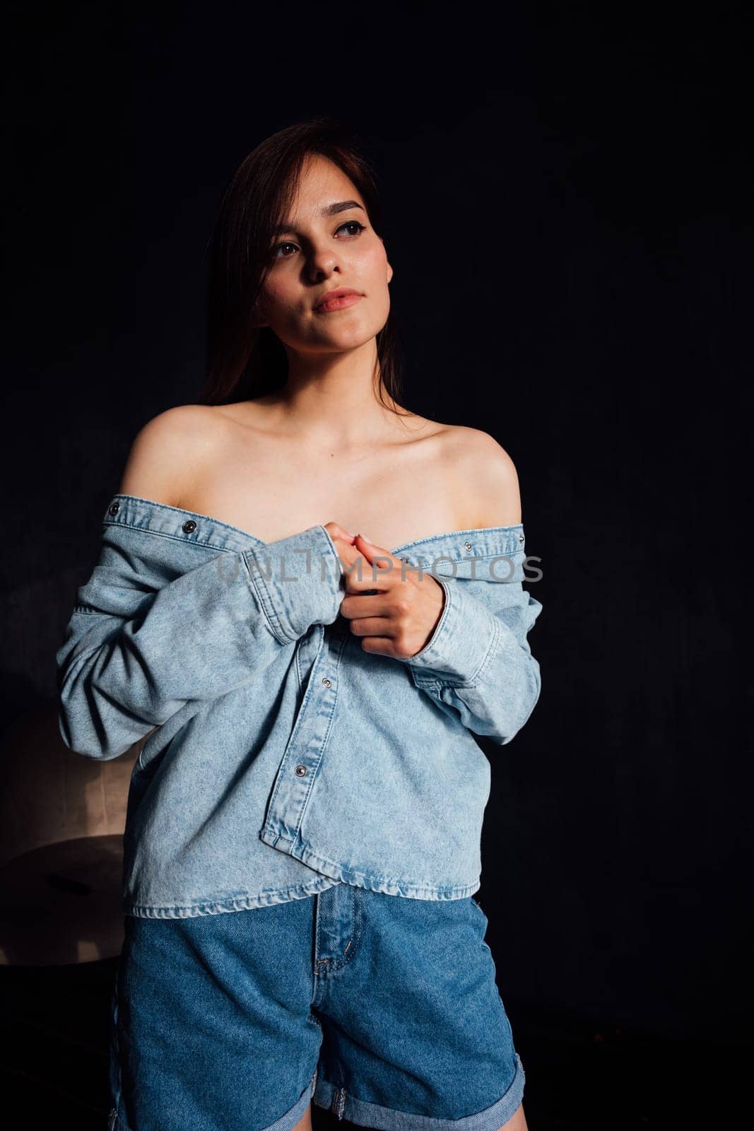 Portrait of a beautiful fashionable young woman in denim clothing by Simakov