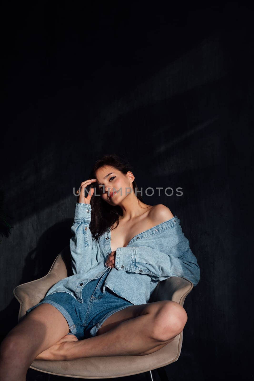 Portrait of a beautiful fashionable young woman in denim clothing by Simakov