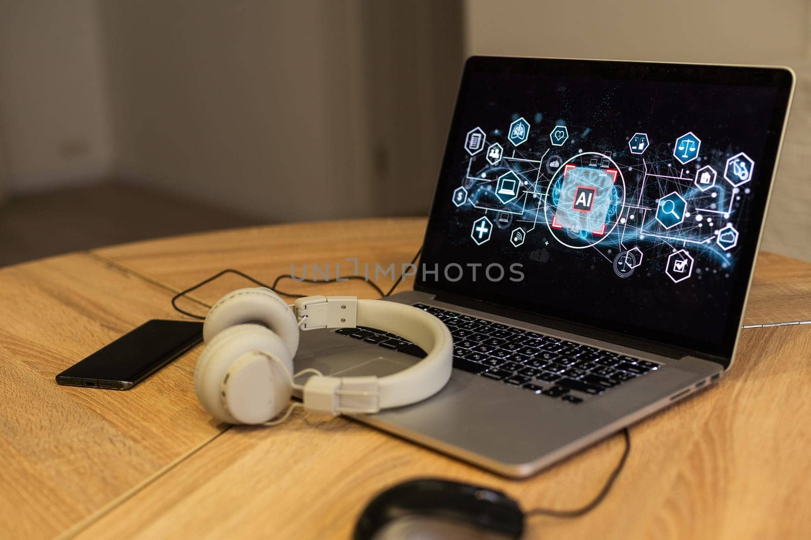 online conversation using laptop and headphones at office desk. High quality photo