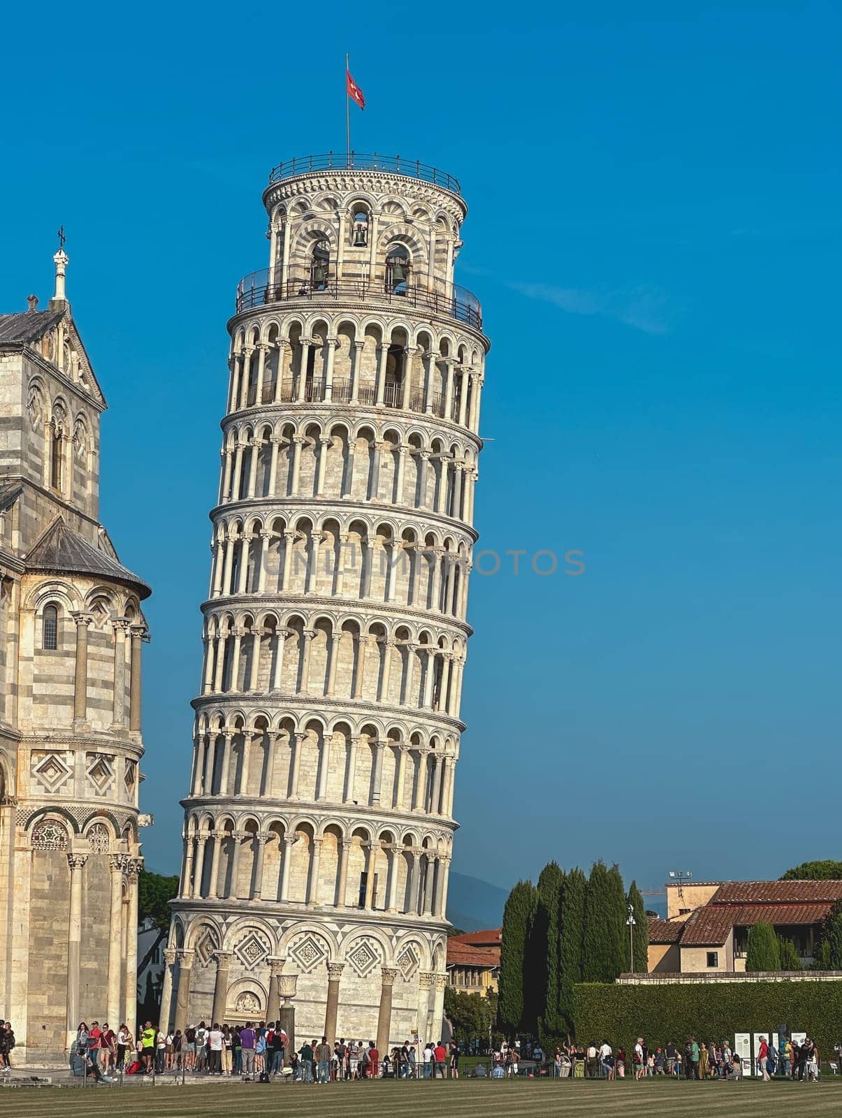 Italy, Tuscany - October 6, 2023: Tourists visiting Pisa tower and cathedral in Italy
