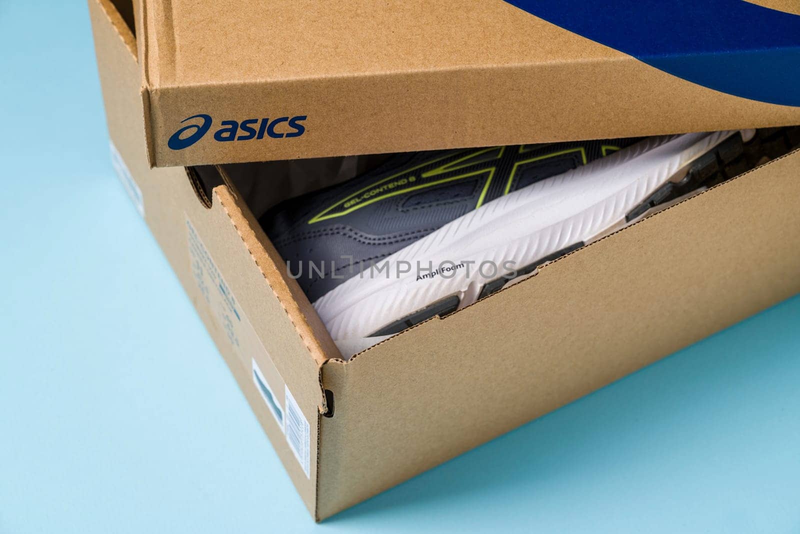 Antalya, Turkey - November 28, 2023: Asics running shoes with new technology soles in shoe box by Sonat