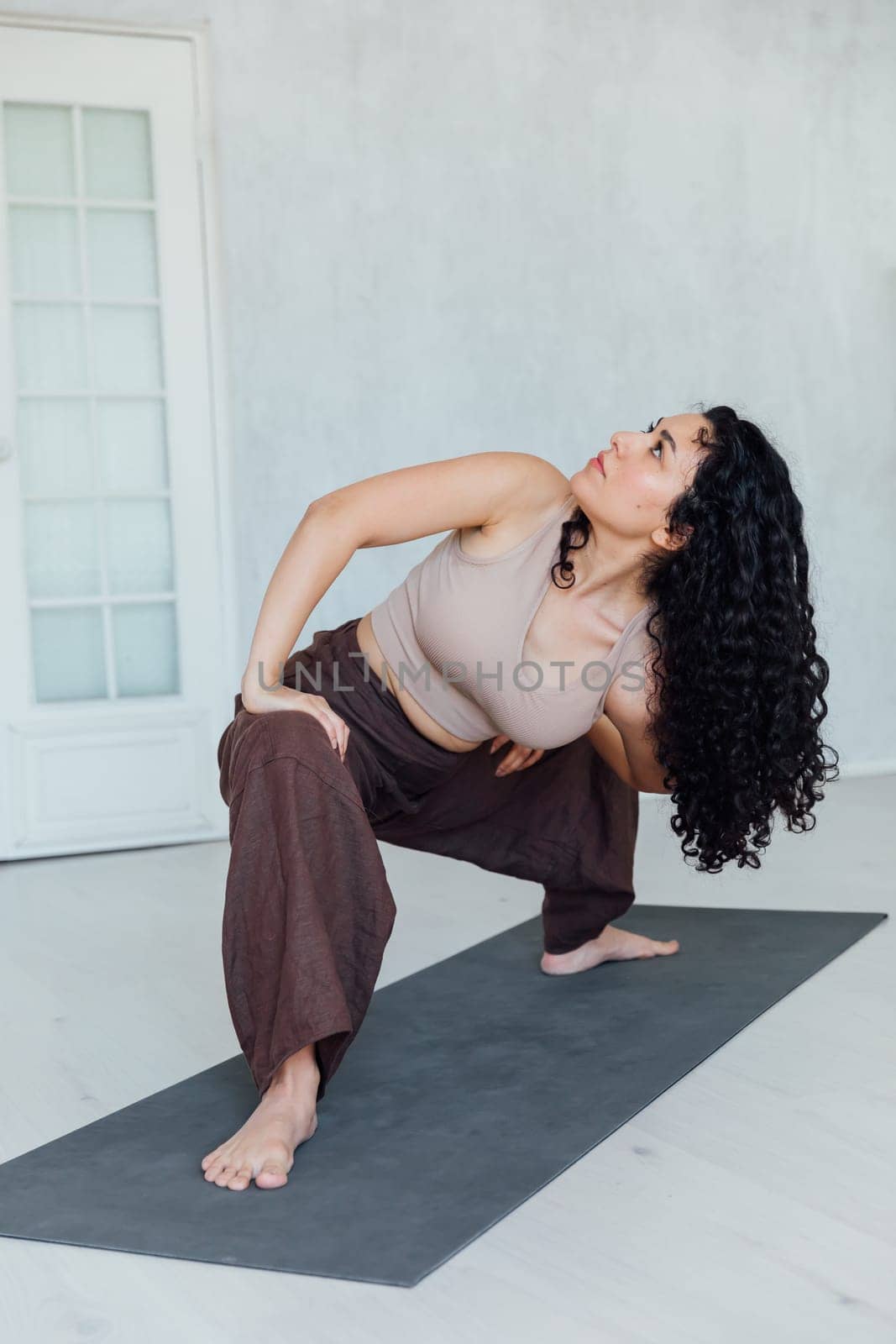 Female yogi doing asana pose exercises