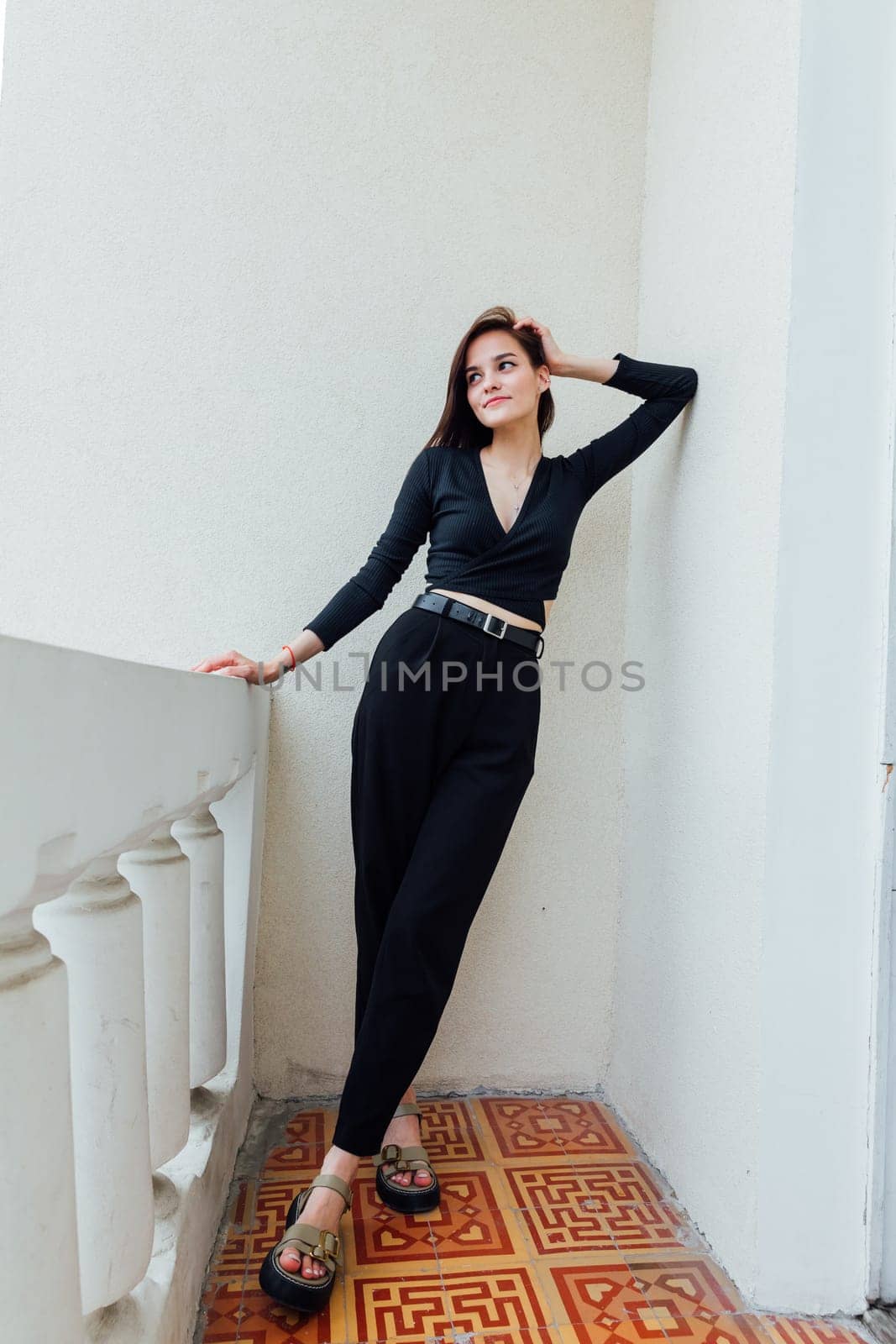 Portrait of a beautiful slender woman in black clothes by Simakov