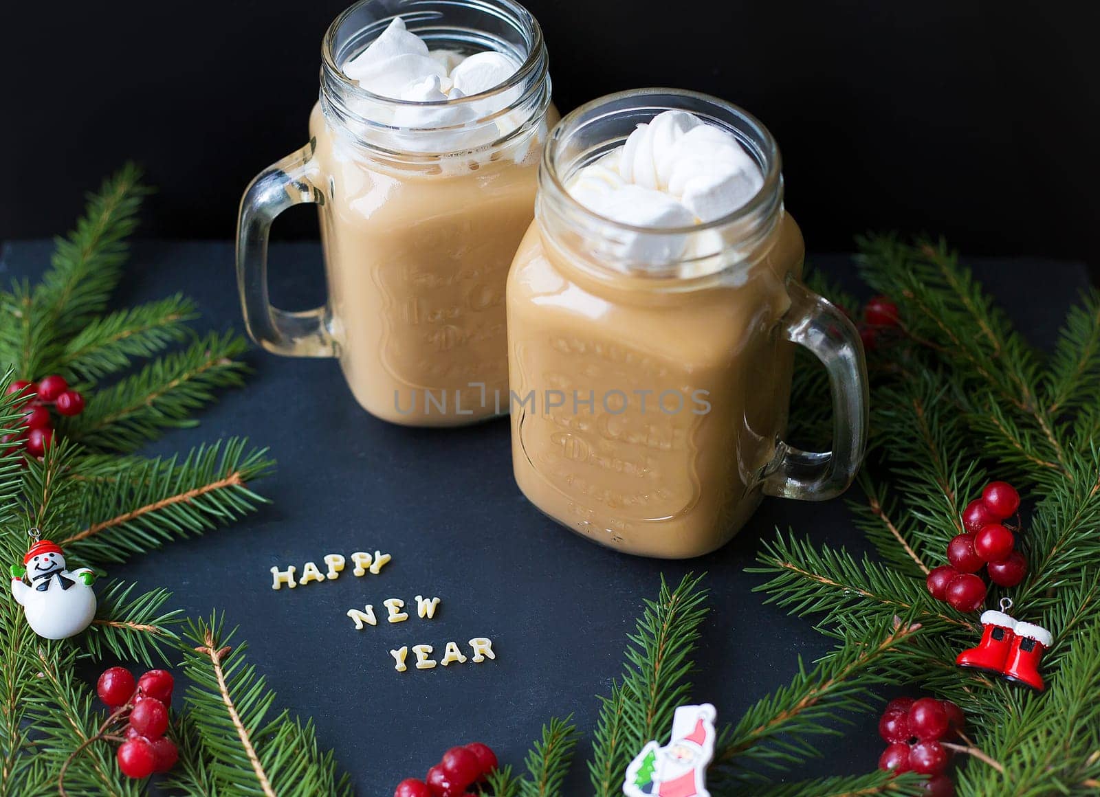 marshmellou cocoa, Christmas tree with decorations on a black background. The inscription Happy New Year.