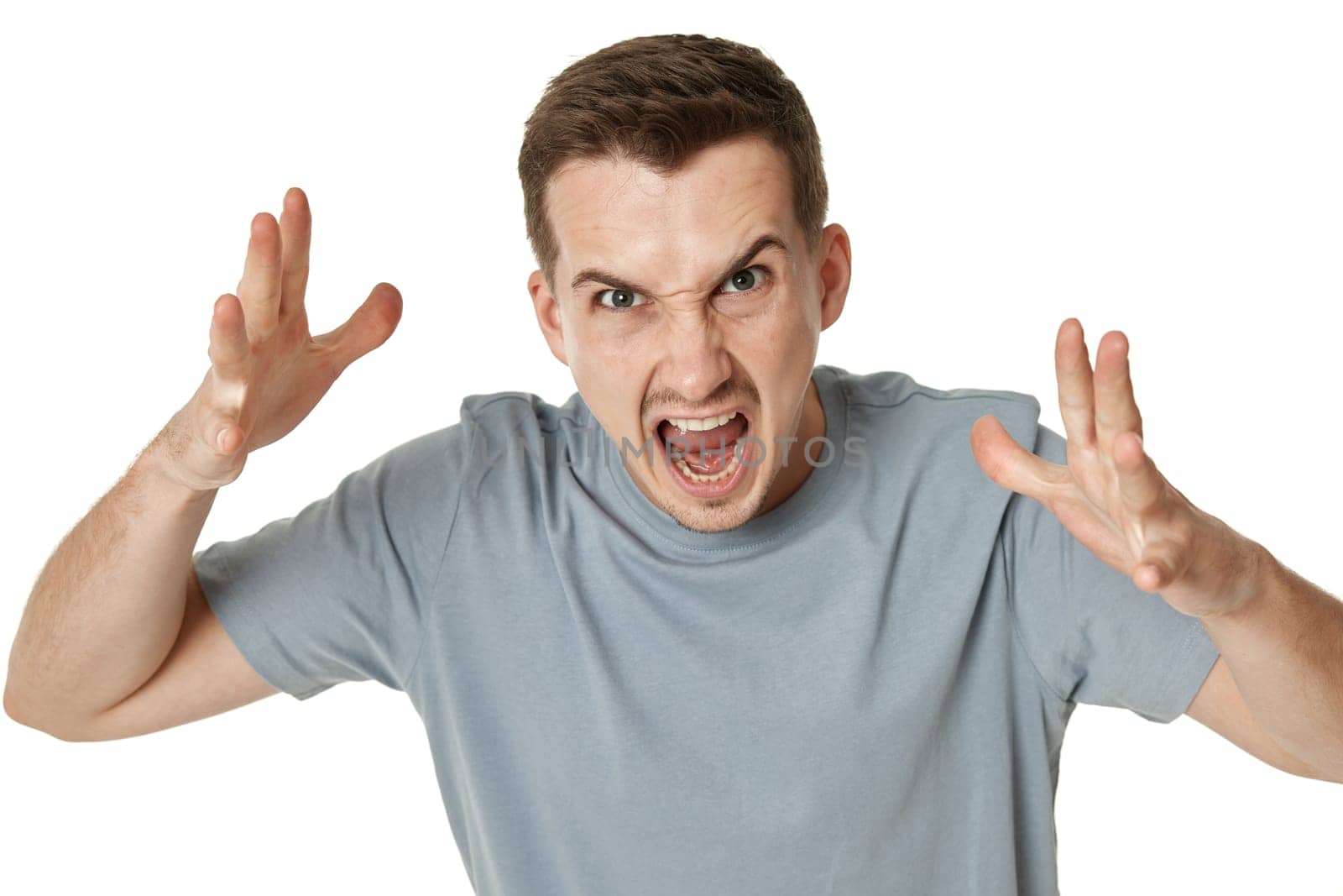 annoyed angry bearded man shouting on white studio background
