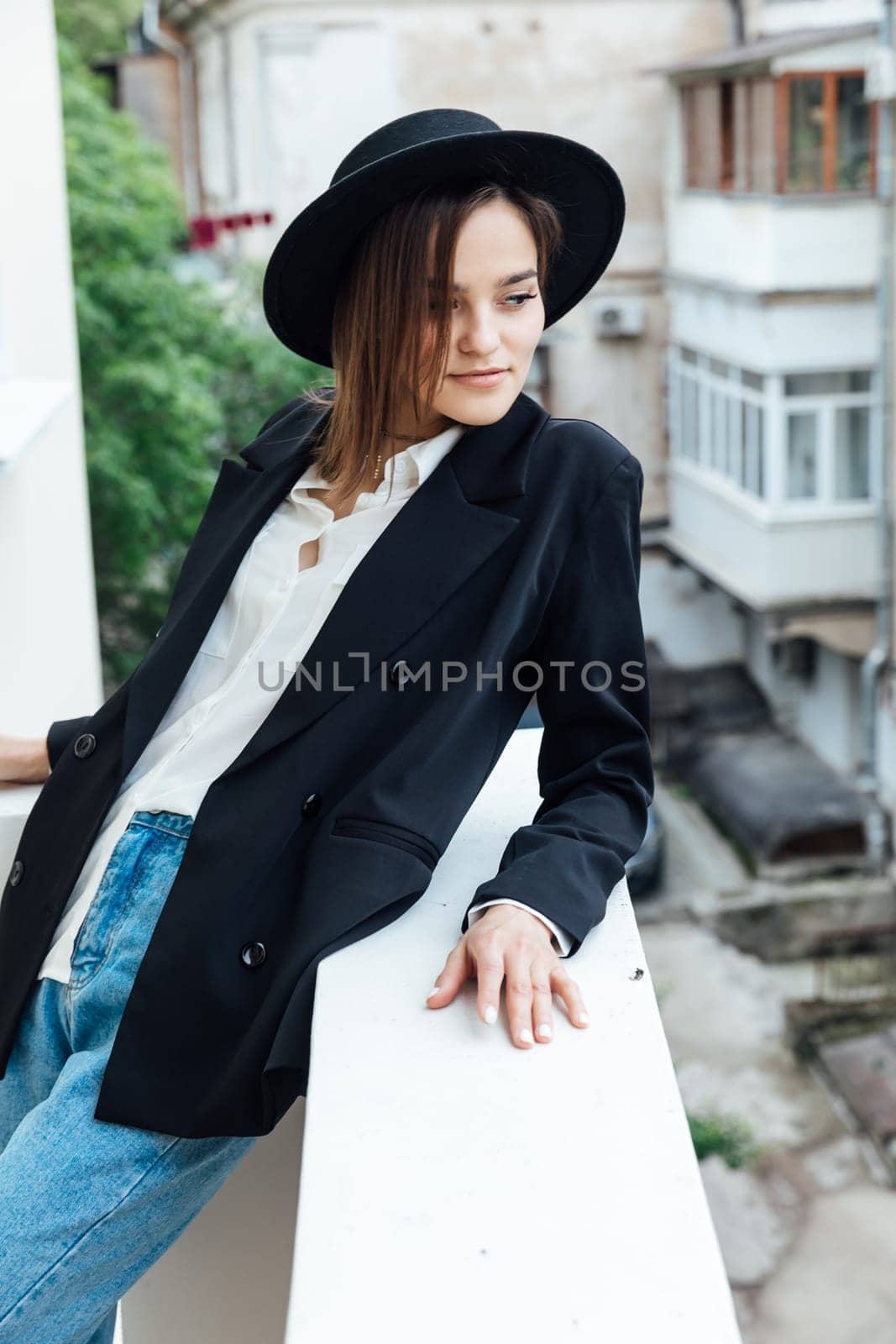 slender brunette woman walking in autumn city by Simakov