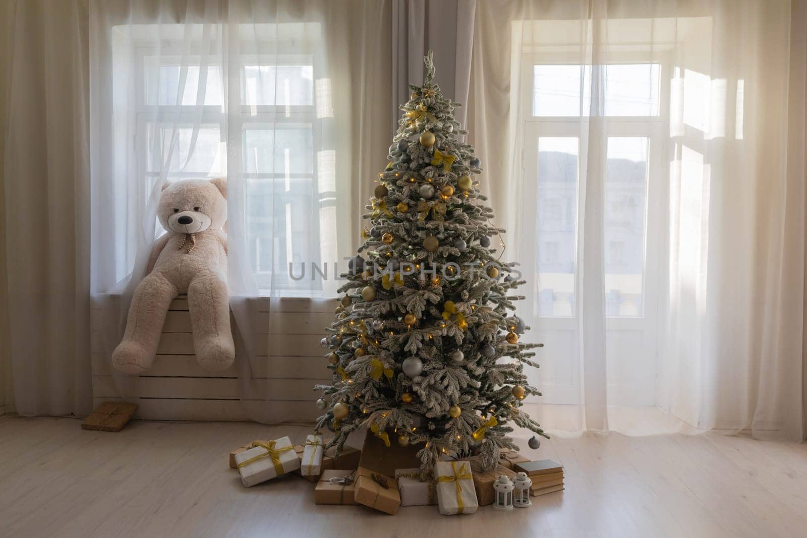 White christmas tree with gifts in interior without people by Simakov