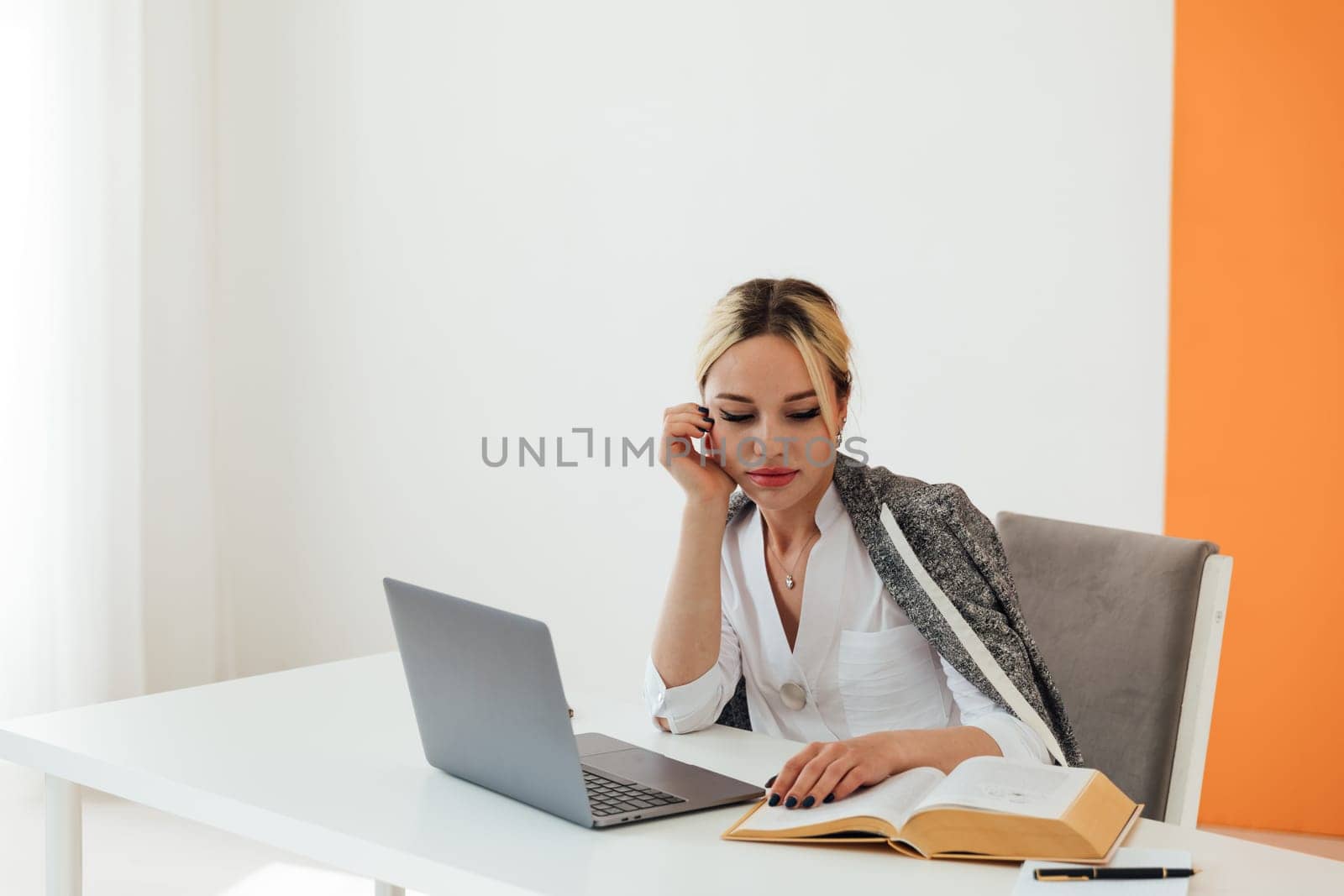 woman tired at work in office at computer