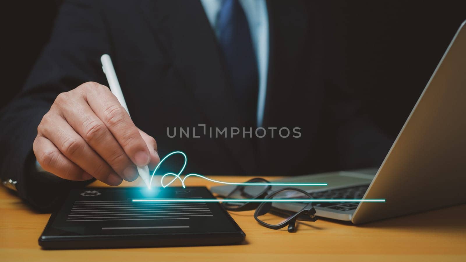 Businessman use electronic pen sign signature on electronic E-signing, data sheet document management, Electronic signature and paperless office concept. by Unimages2527