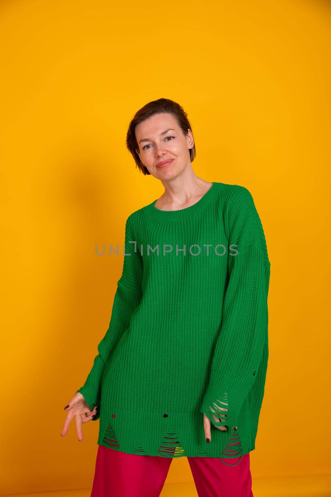 Beautiful woman in green autumn sweater by Simakov