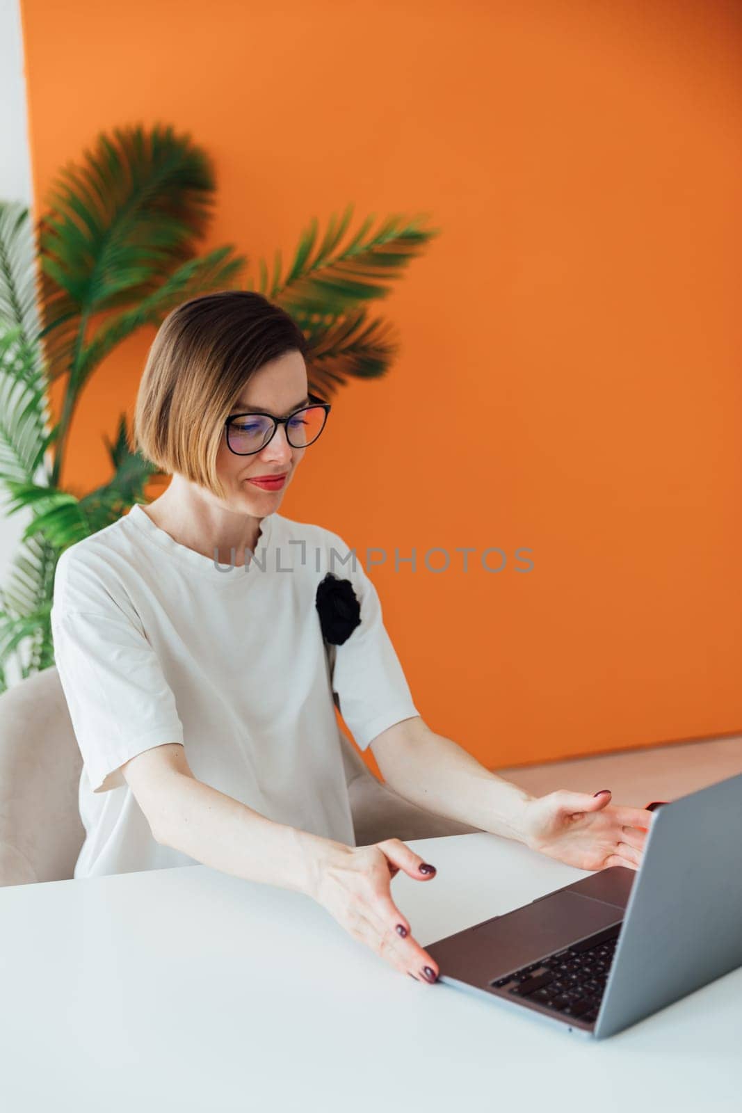 Business woman working online at computer in office by Simakov