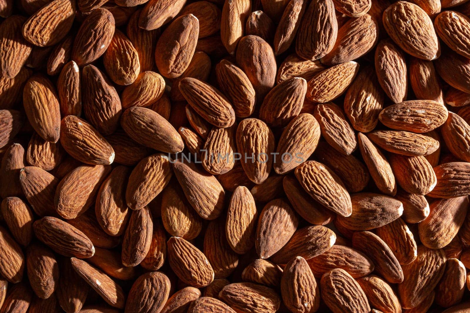 Scattered Almonds. Background from Almond Nuts by InfinitumProdux