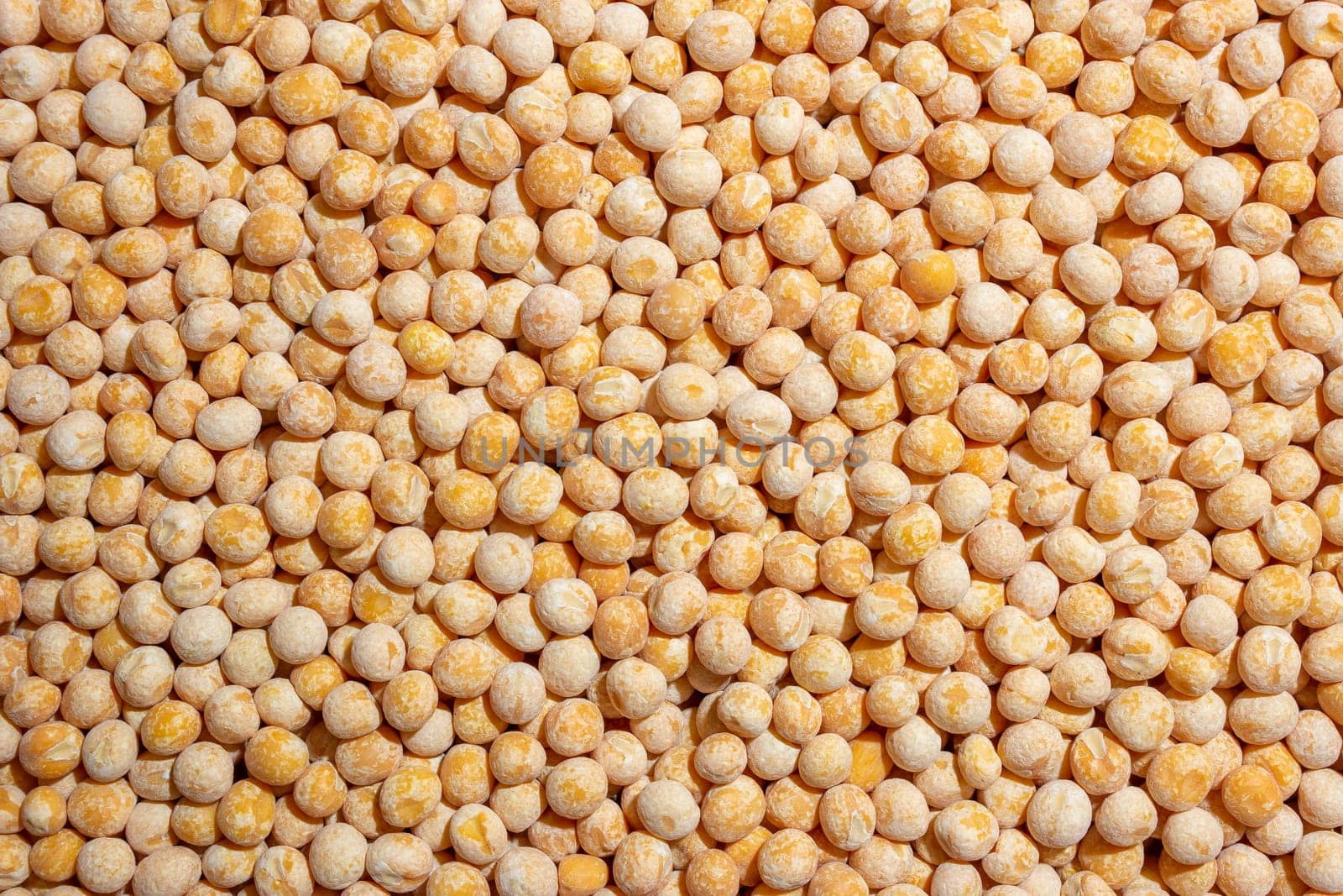 Uncooked Yellow Polished Peas Background by InfinitumProdux