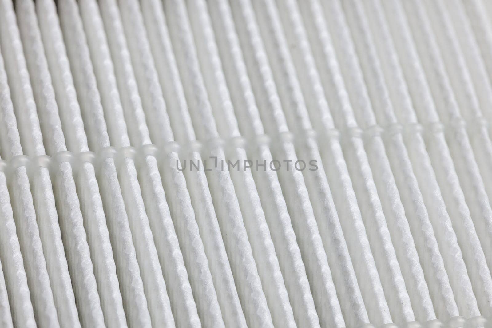closeup full-frame view of white linear HEPA - high effective particle air - filter