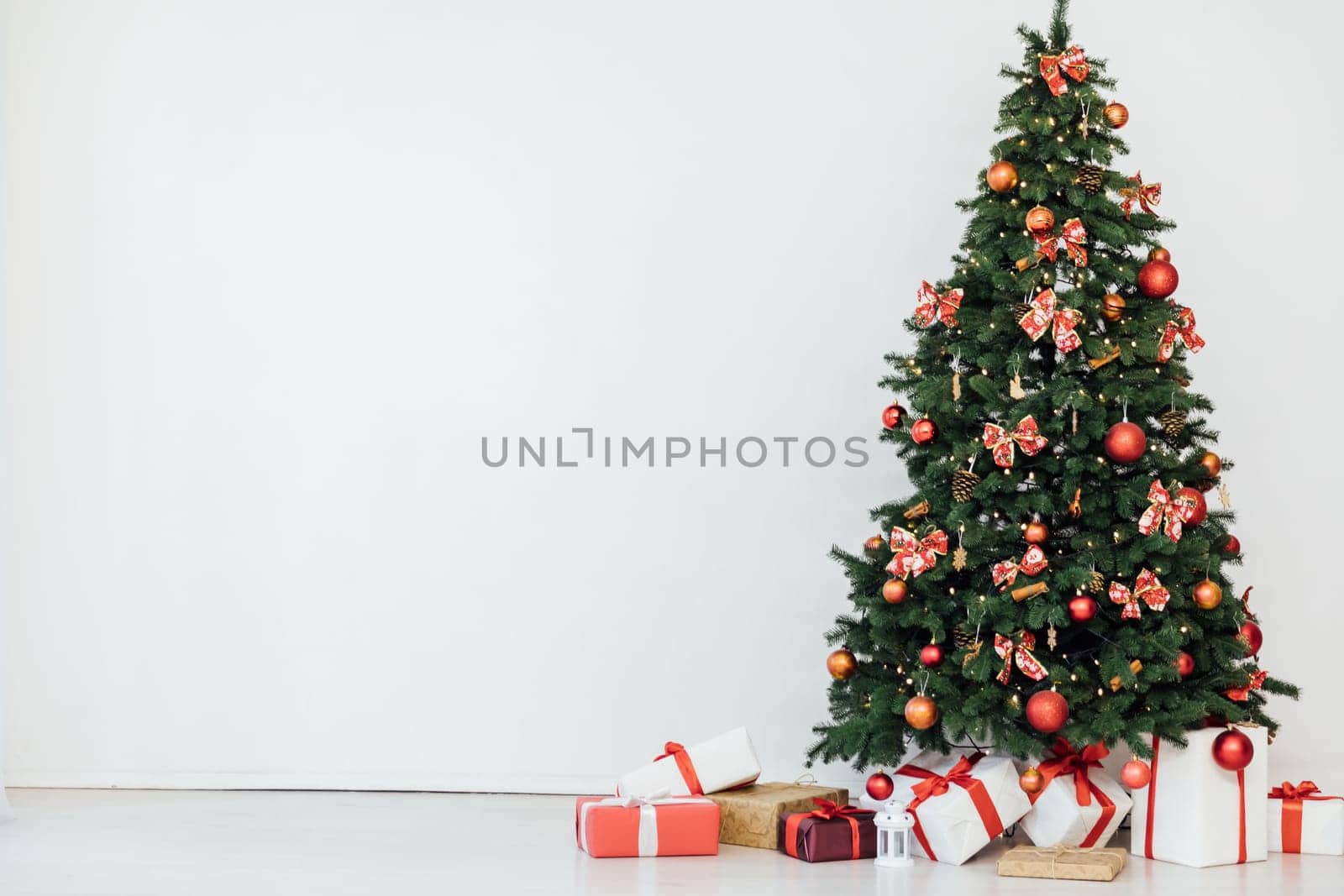 Christmas tree with gifts and toys interior decoration new year by Simakov