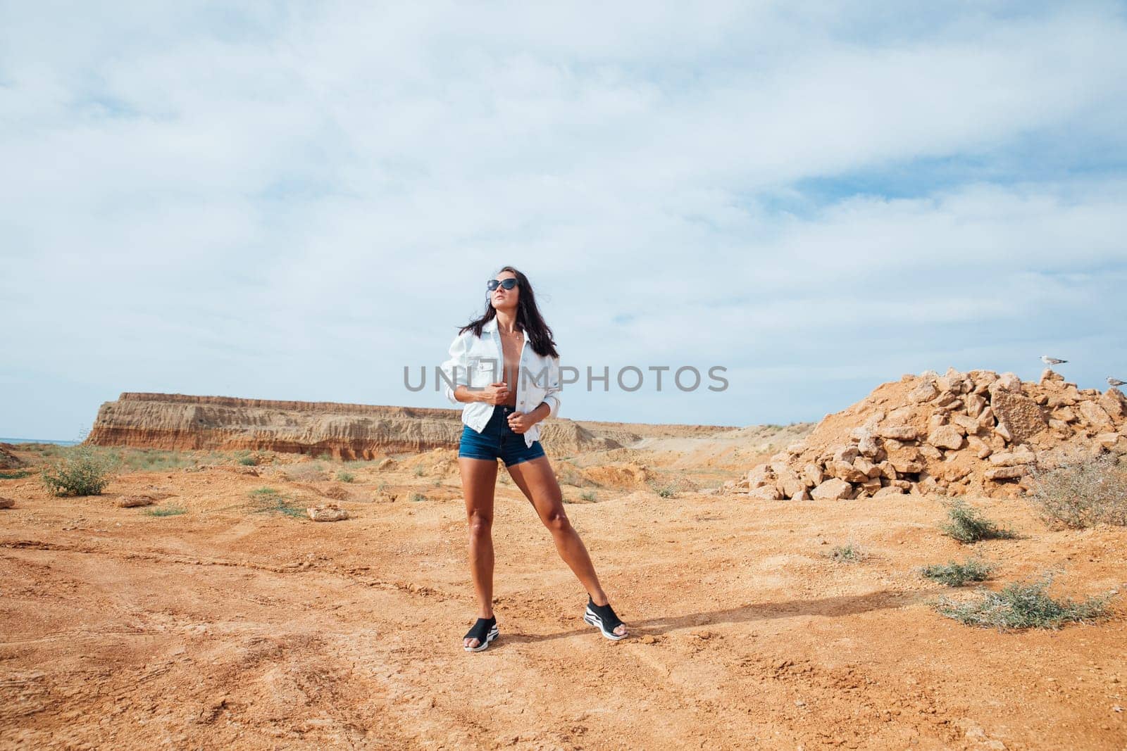 Portrait of beautiful tanned brunette woman outdoors by Simakov