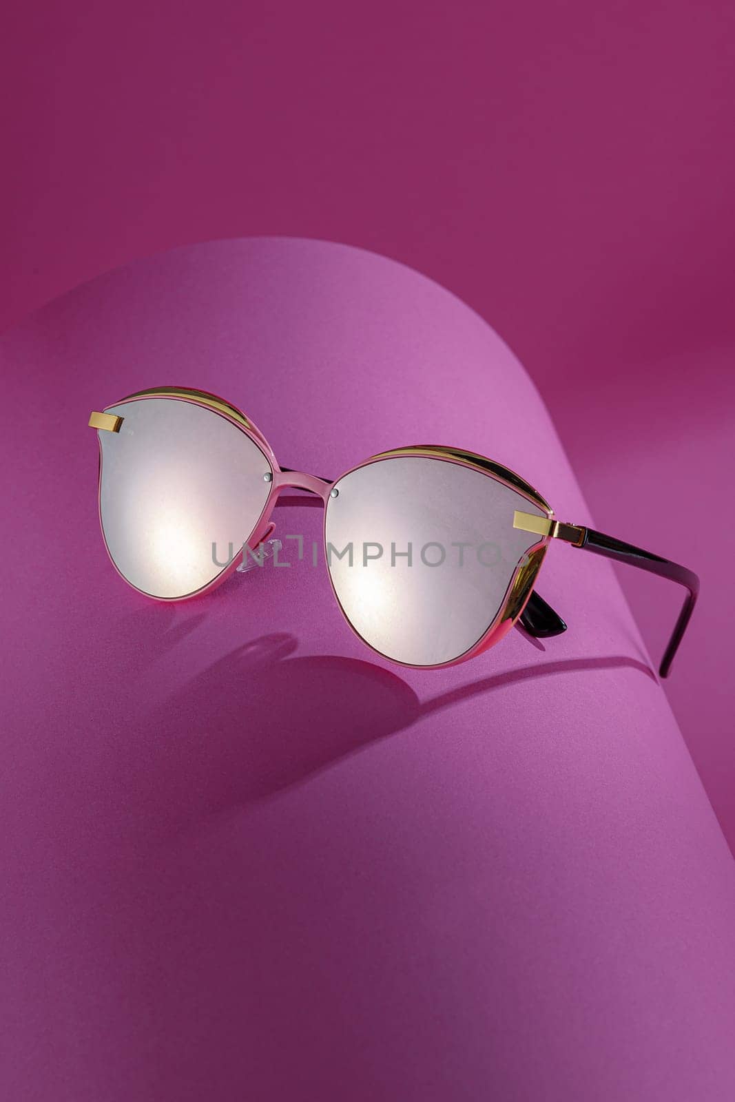 Trendy sunglasses background. Fashion summer accessories. Copy space for text. Pink concept. Optic store discount poster by Gravika