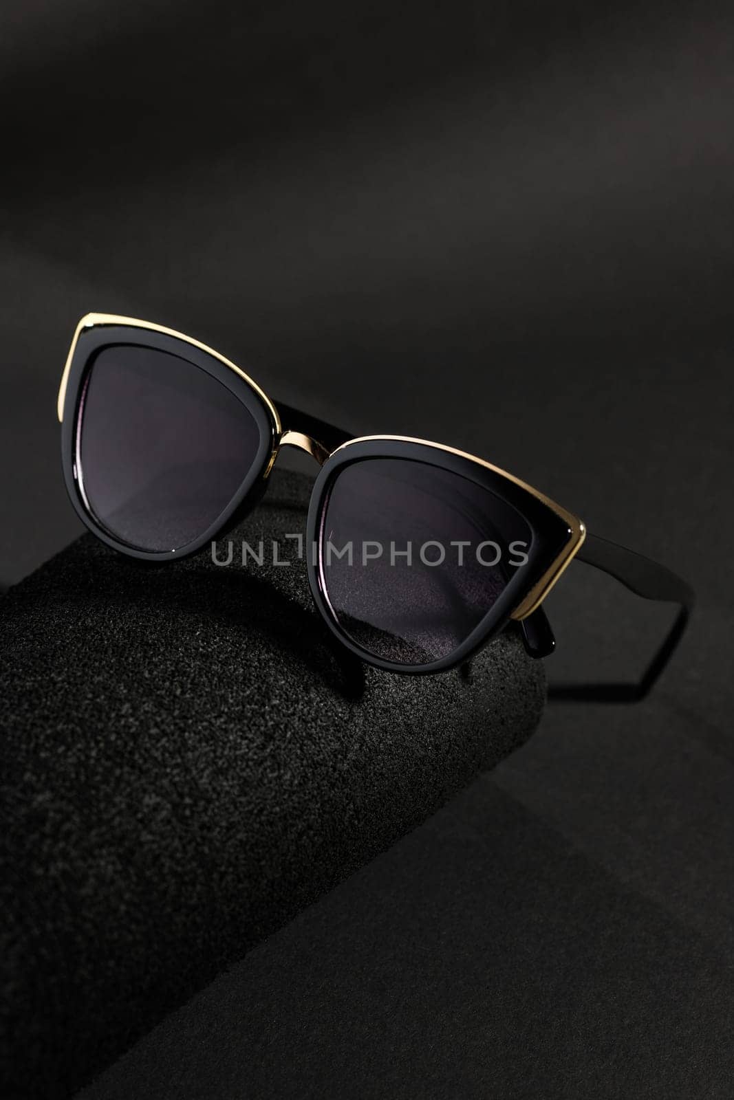stylish women's sunglasses isolated on color paper background