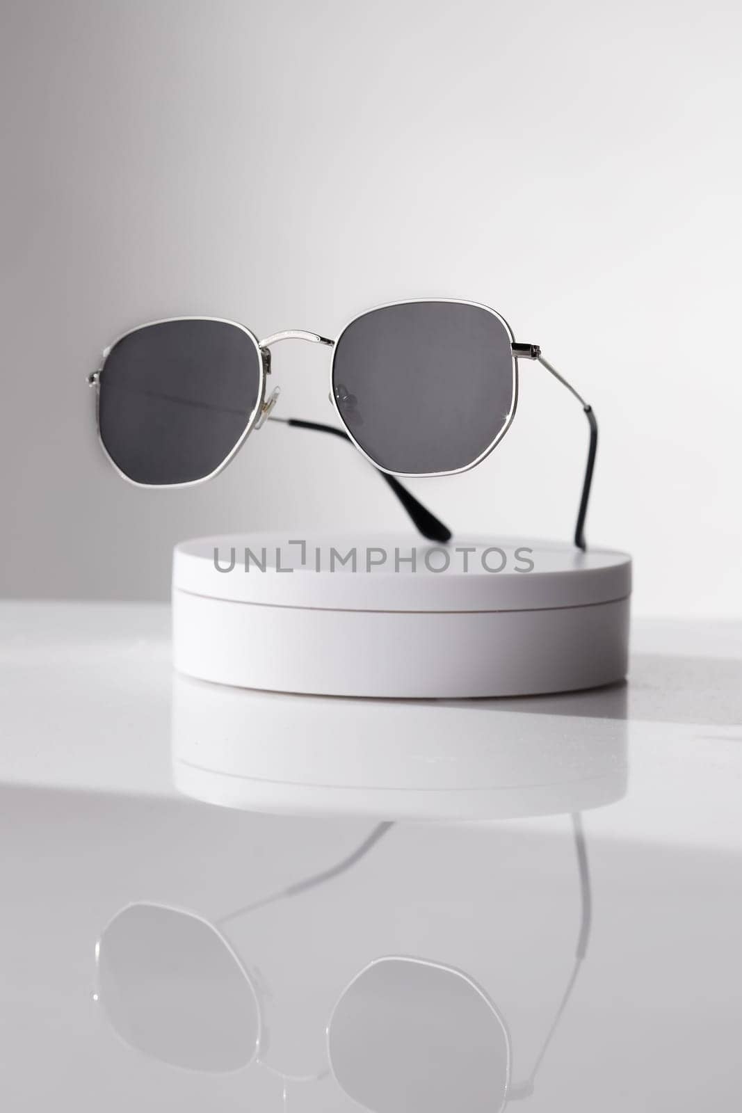Trendy sunglasses background. Fashion summer accessories. Copy space for text. Black white concept. Optic store discount poster by Gravika