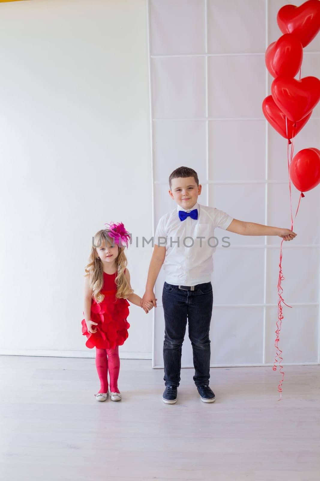 boy and girl with air in the shape of a heart