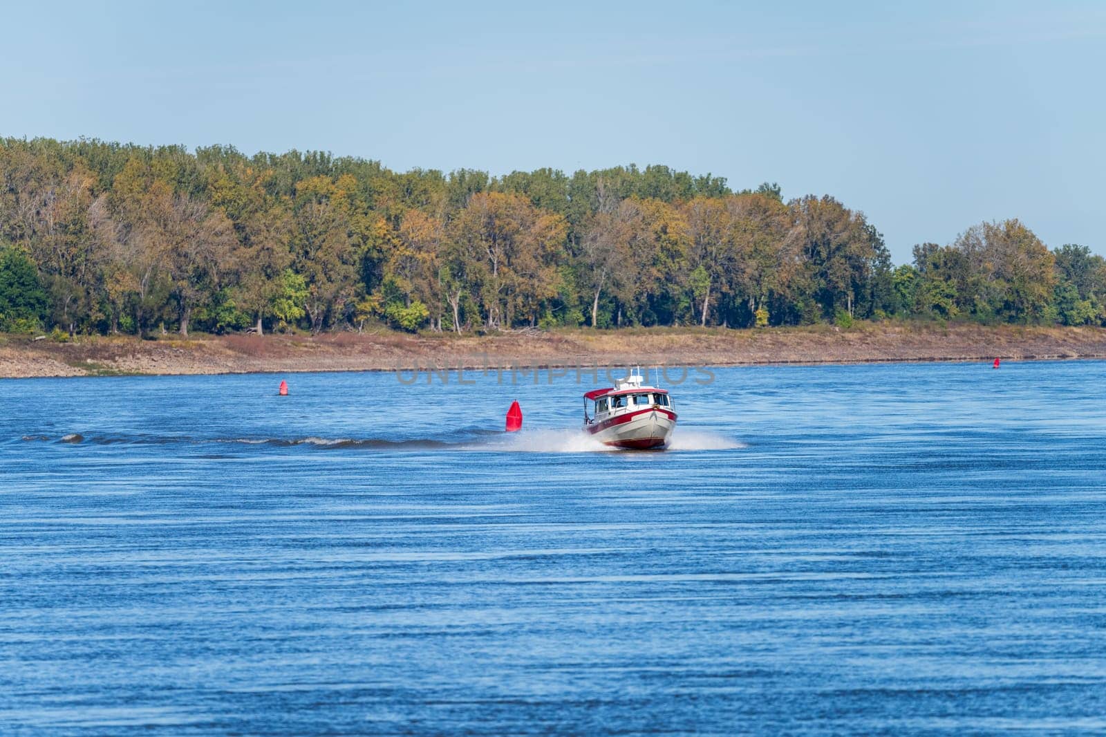 Small powerful speedboat on Mississippi River near Cairo Illinois by steheap