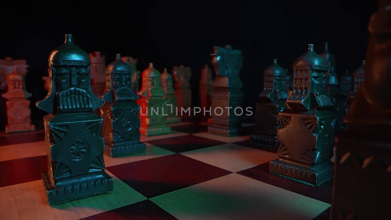 Slavic old styled chess pieces on wooden chessboard before party competition. Board strategy game. Teamwork, success business, intelligence sport concept. Slider macro shot. High quality