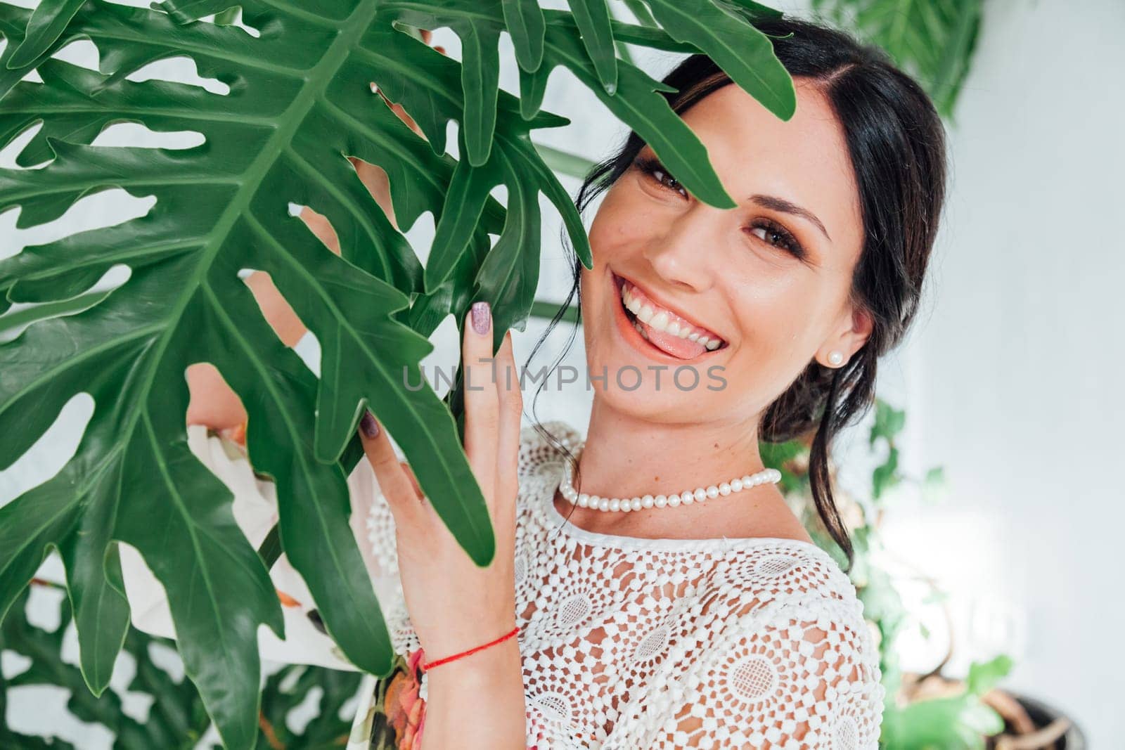 beautiful brunette woman in a dress with flowers