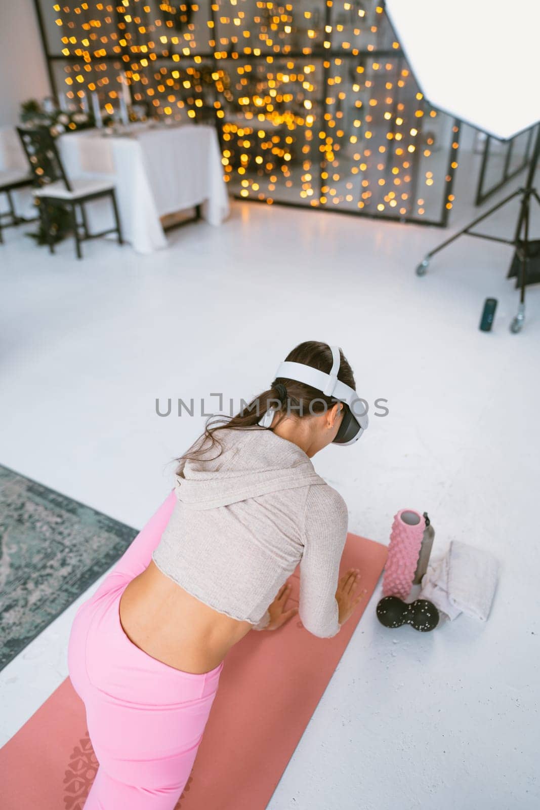 Arm warm-ups as part of home exercise routines with a virtual reality headset during the Christmas holidays. High quality photo