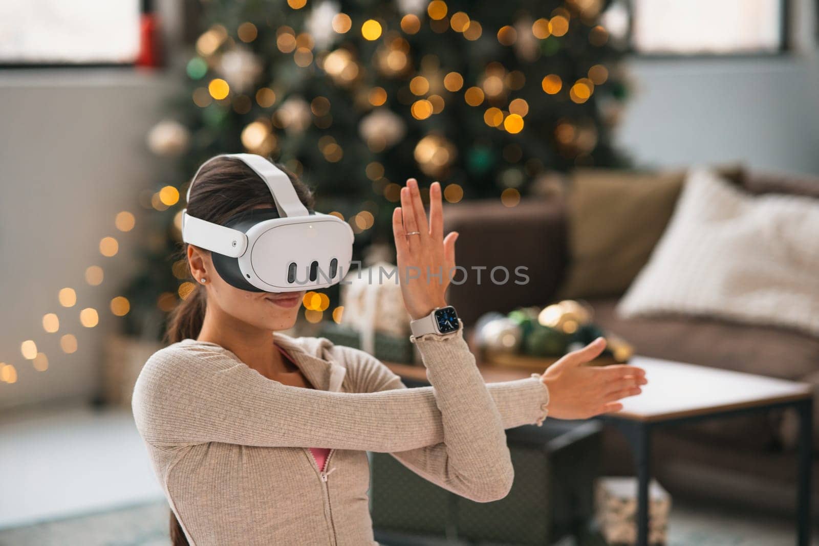 A stylish young woman in workout gear doing stretching exercises in virtual reality. High quality photo