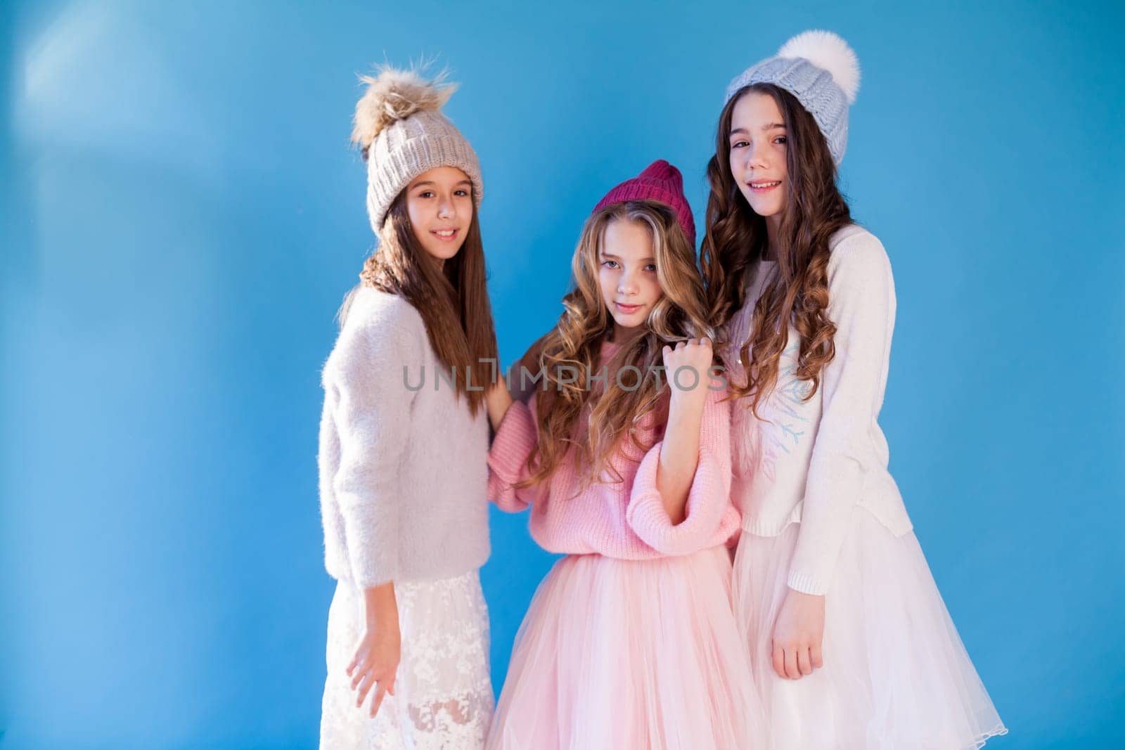 girls school girlfriends in winter snow cold hats