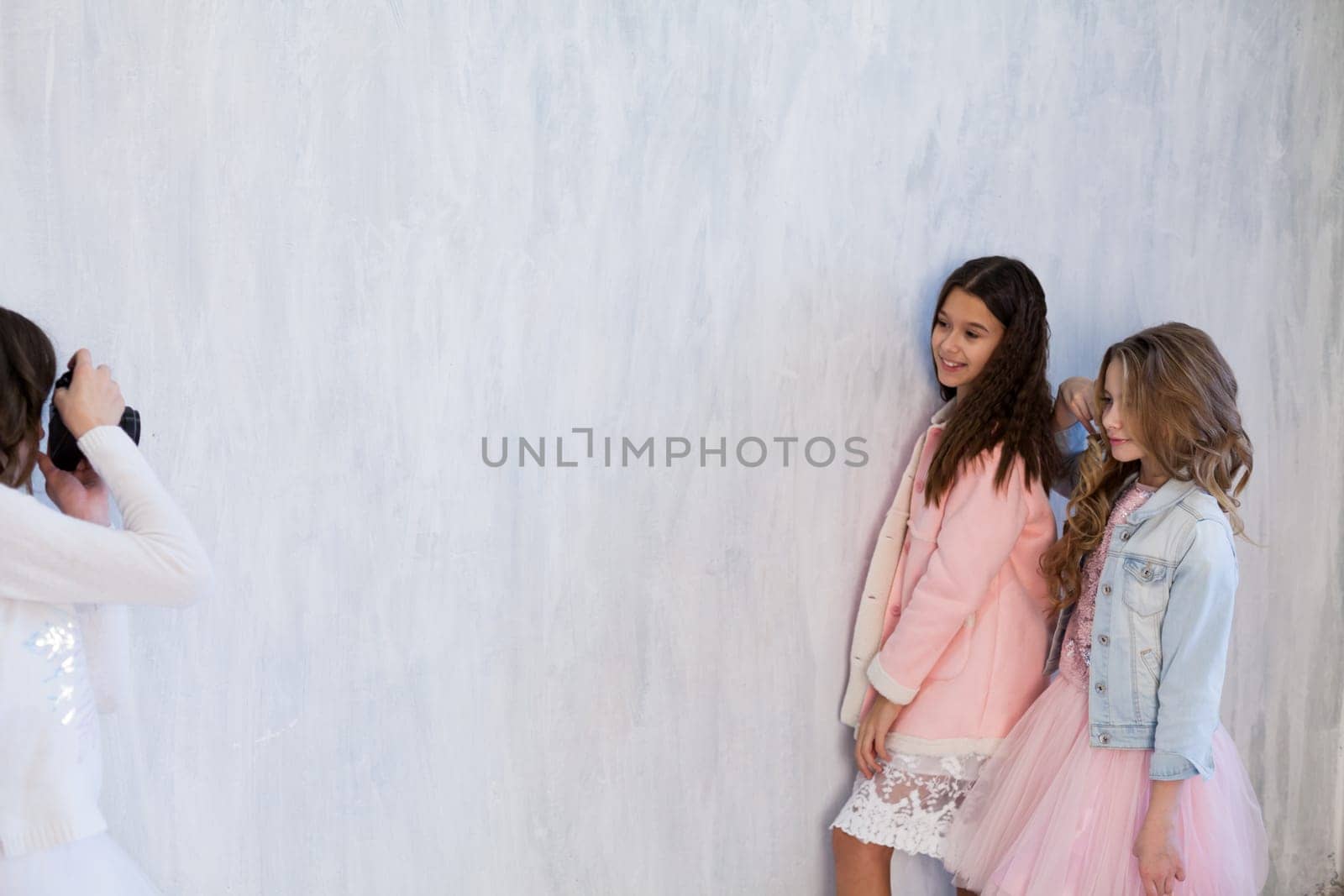 three fashionable girls school girlfriends in white pink dresses by Simakov