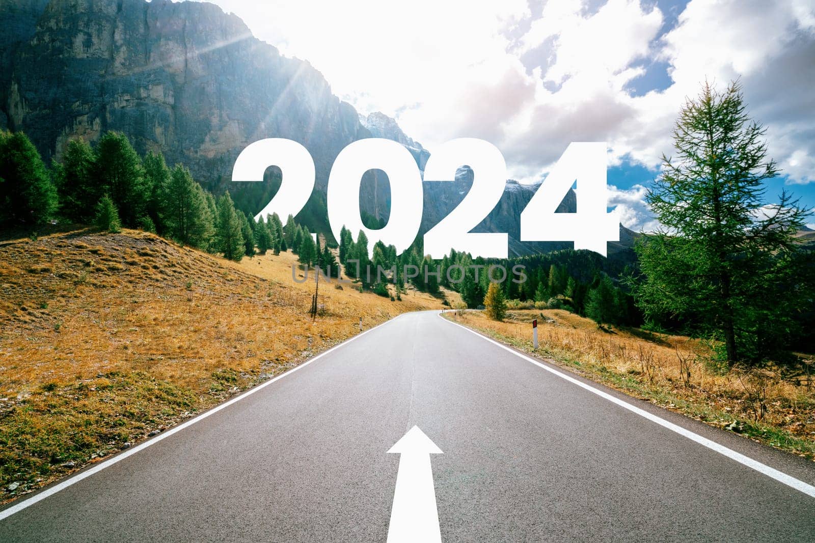 2024 New Year road trip travel and future vision concept . Nature landscape with highway road leading forward to happy new year celebration in the beginning of 2024 for bliss and successful start .