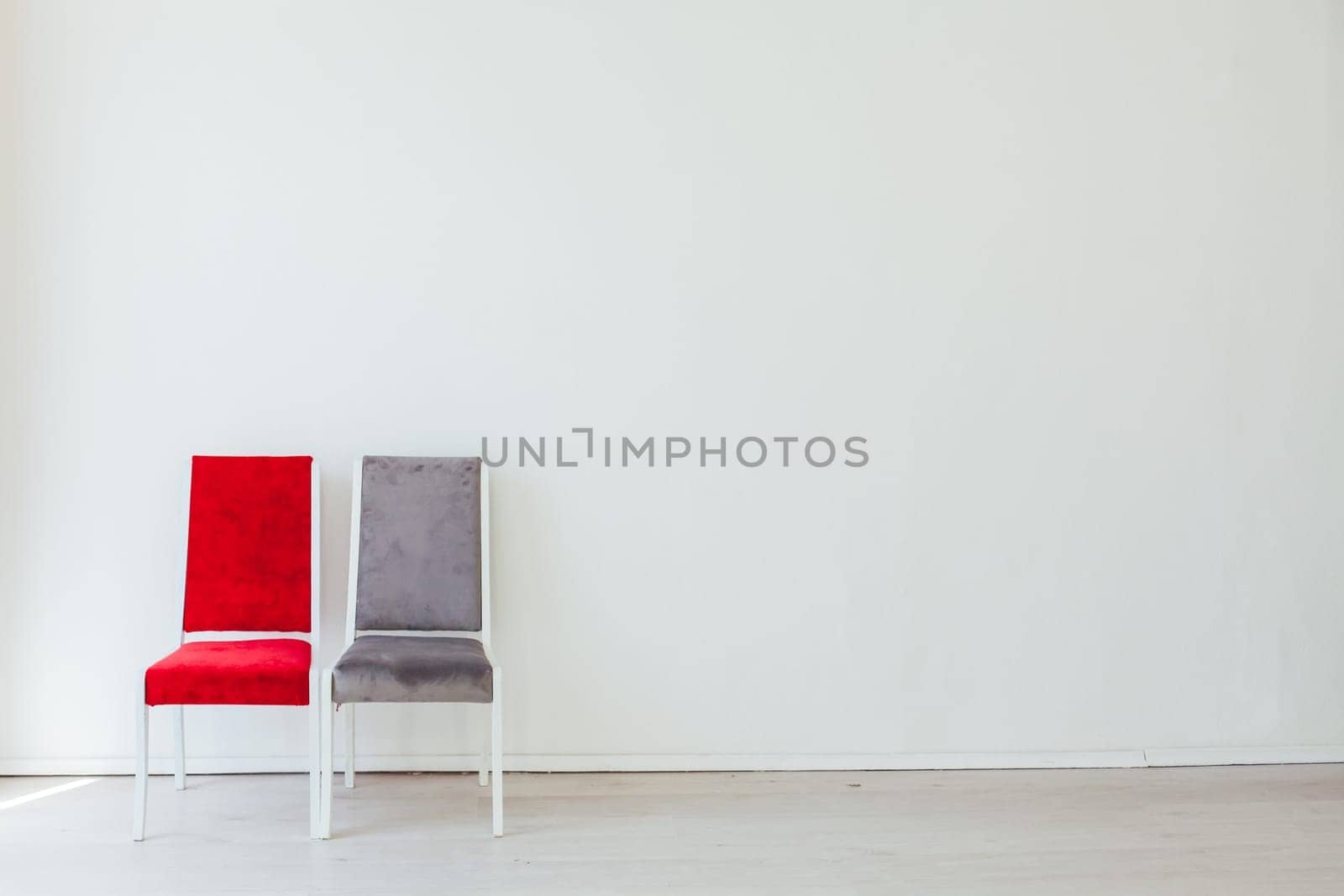 two chairs in the interior of white room by Simakov