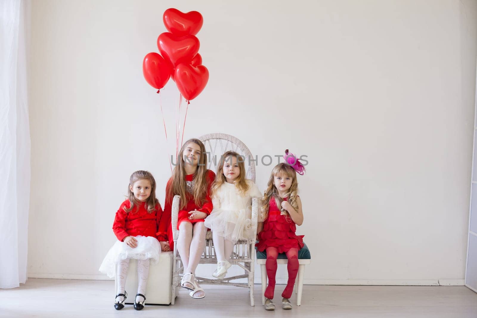 four girls in red and white clothes with balloons by Simakov