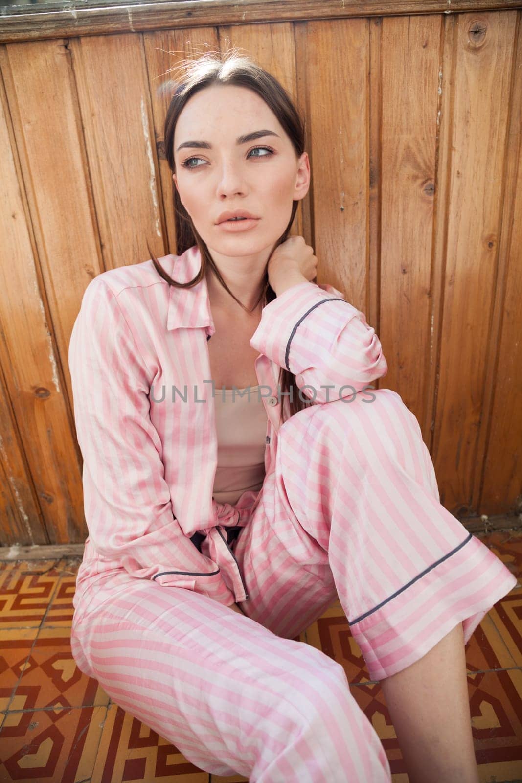 woman in pajamas in the bedroom on the bed