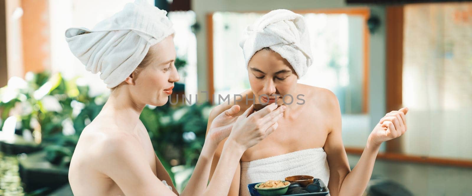 Couple of beautiful girls interested in homemade facial mask.Tranquility. by biancoblue