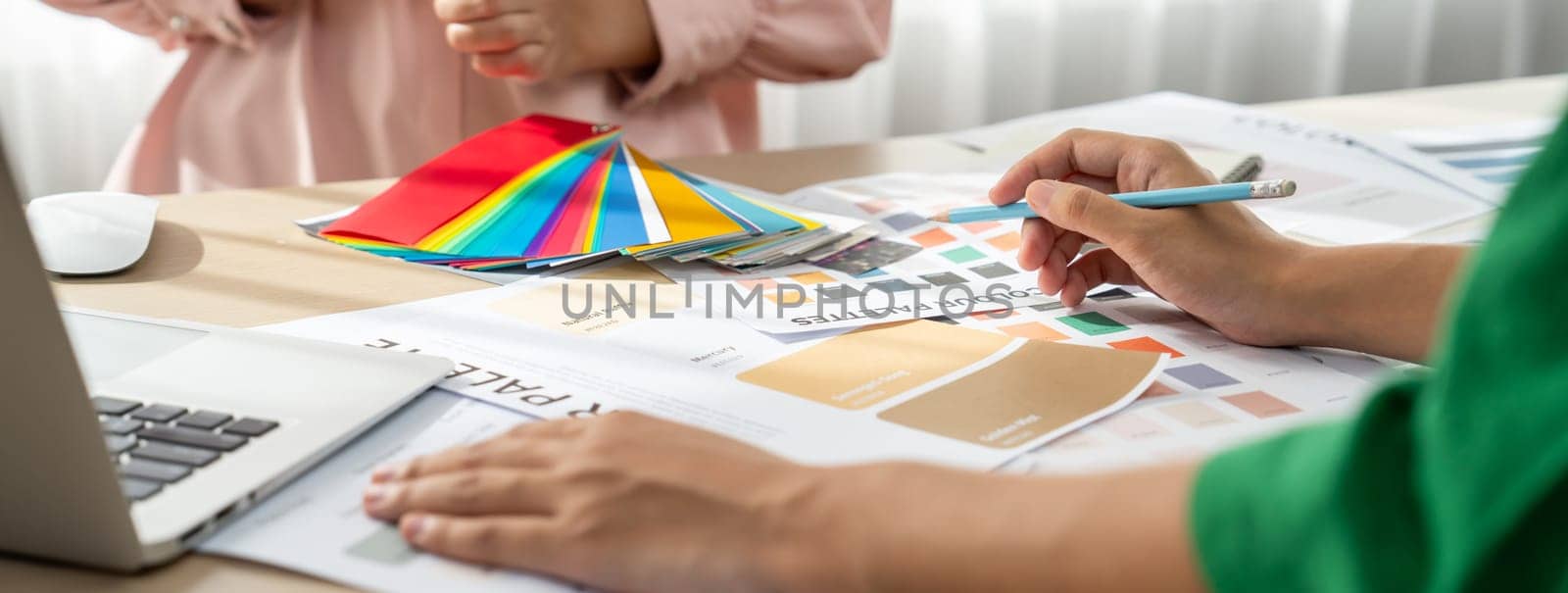 Interior designer choose appropriate color from color palette. Variegated by biancoblue