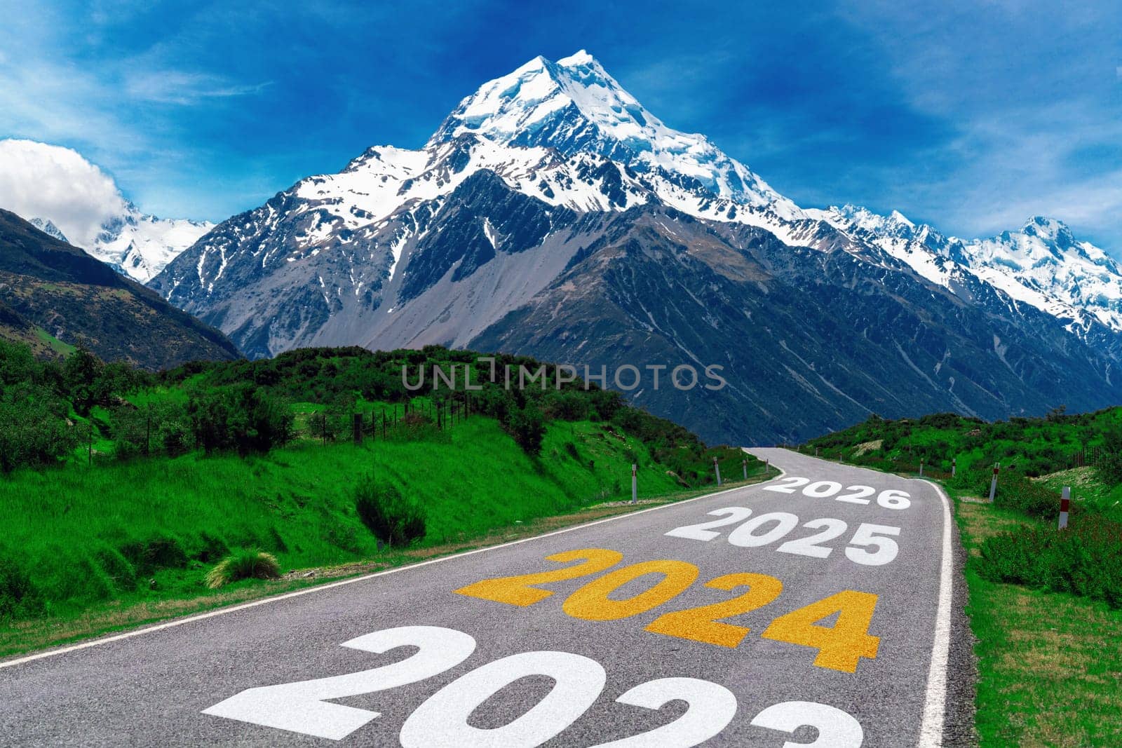 2024 New Year road trip travel and future vision concept . Nature landscape with highway road leading forward to happy new year celebration in the beginning of 2024 for bliss and successful start .