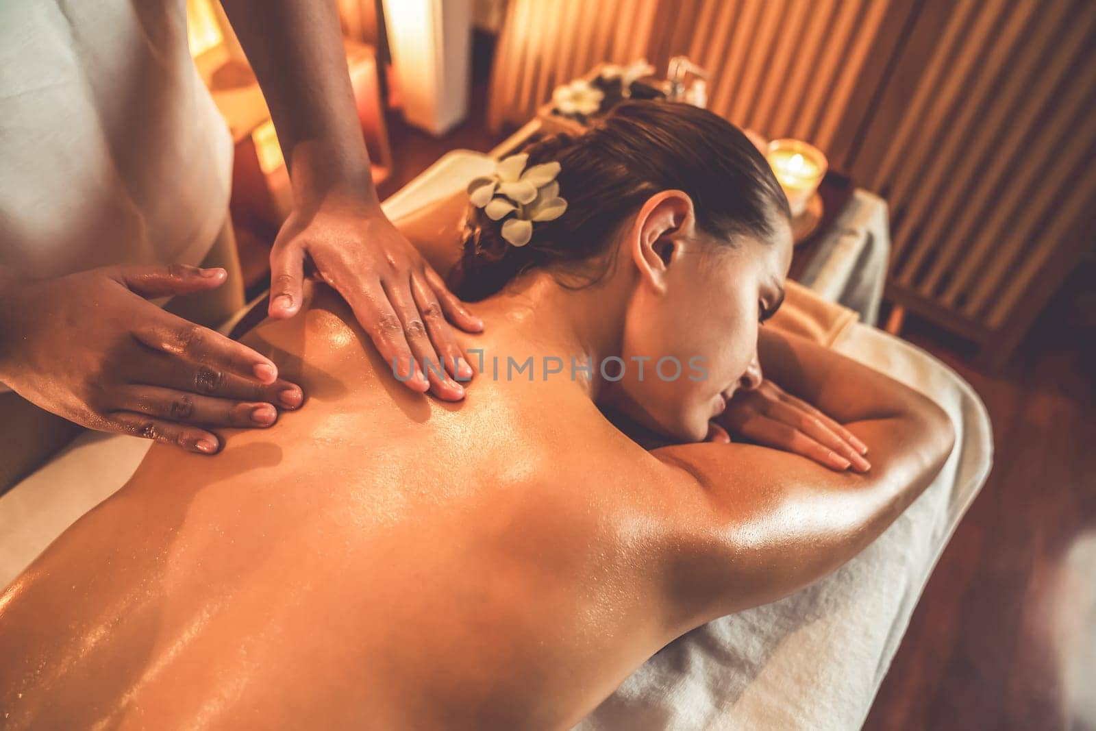 Caucasian woman customer enjoying relaxing anti-stress massage. Quiescent by biancoblue