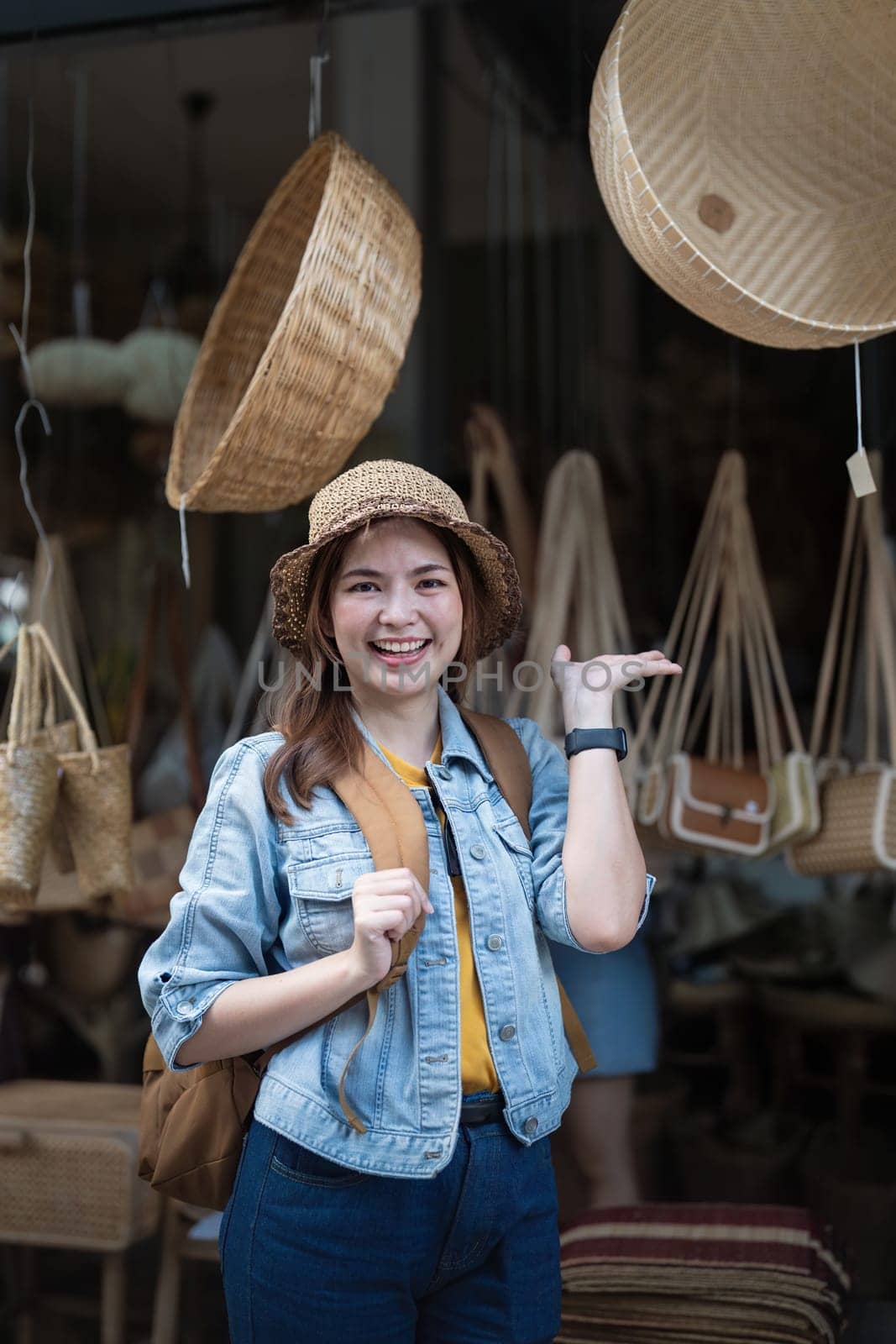 Young beautiful woman traveling at the local market during vacation. Tourist women travel enjoy shopping market during holidays, backpacker traveller by nateemee