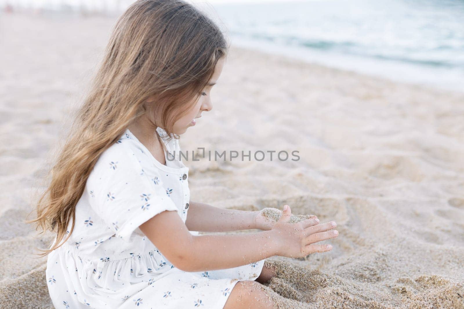 Little girl enjoying summer vacation at the sea.