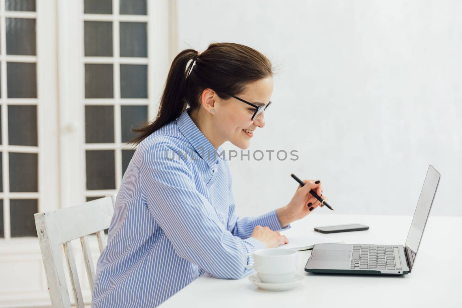 Smiling caucasian young businesswoman bank employee worker manager boss ceo looking at camera, using laptop for distant education work, e-learning, watching webinars online isolated in white