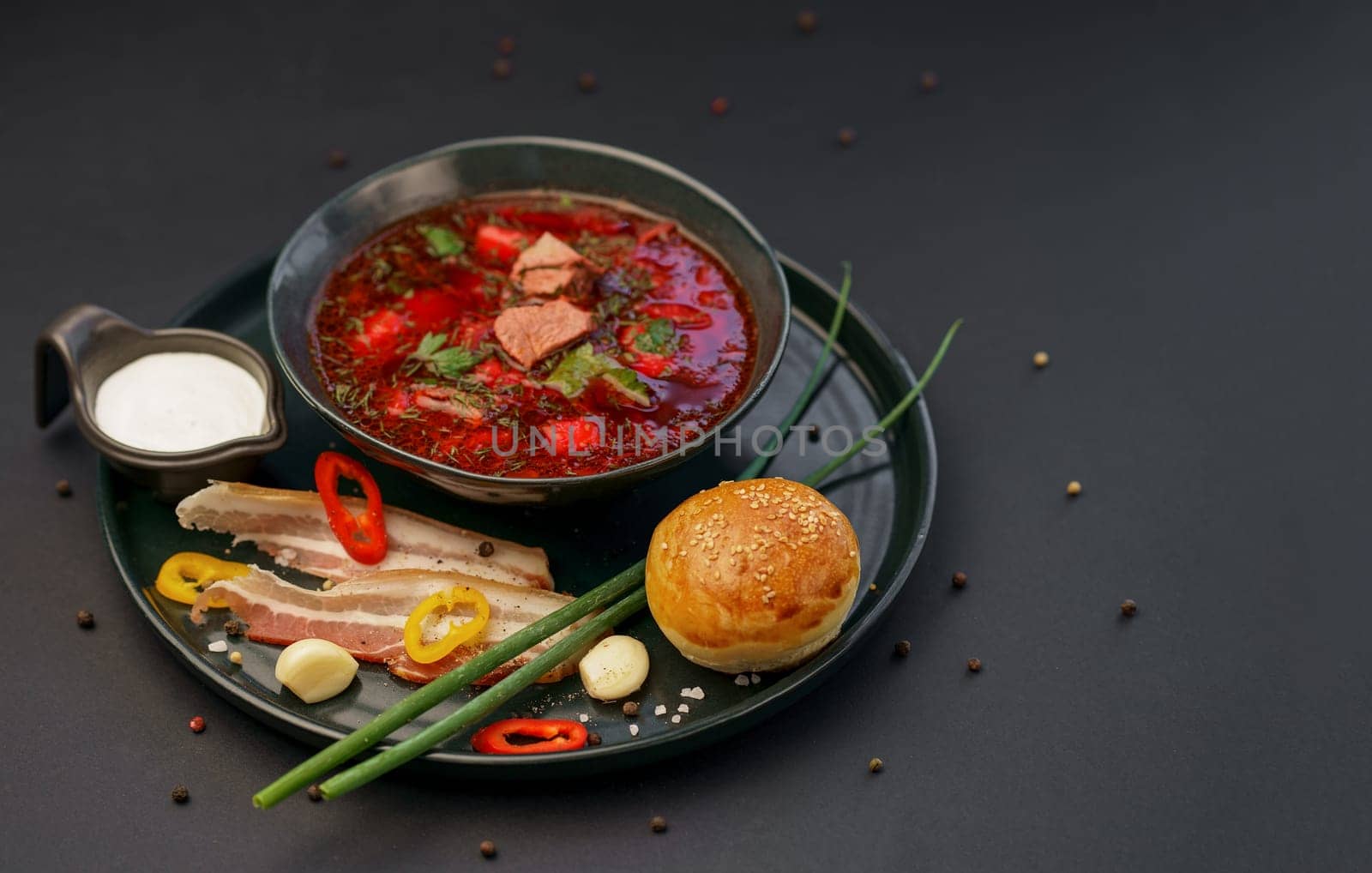 Traditional Ukrainian Russian borscht . Bowl of red beet root soup borsch with white cream . Beet Root delicious soup . Traditional Ukraine food cuisine by aprilphoto