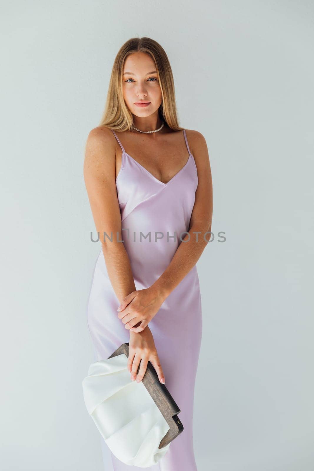 Portrait of a blonde woman in a dress