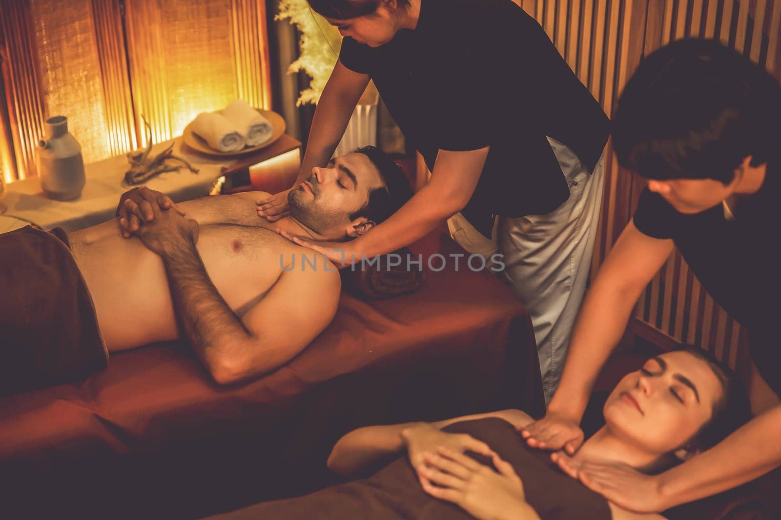 Caucasian couple customer enjoying relaxing anti-stress massage. Quiescent by biancoblue