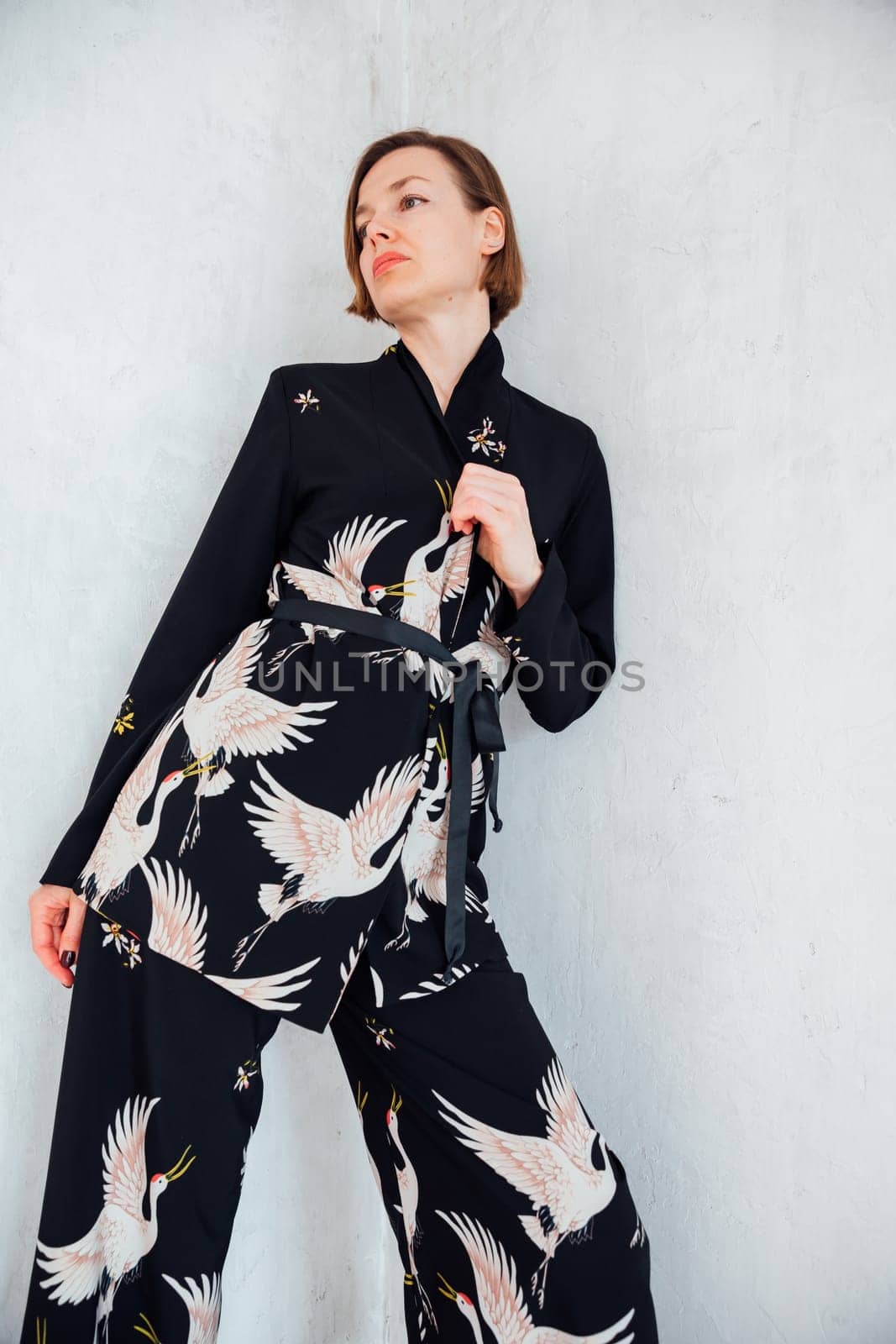 Portrait of fashionable slender brunette woman 40 years old